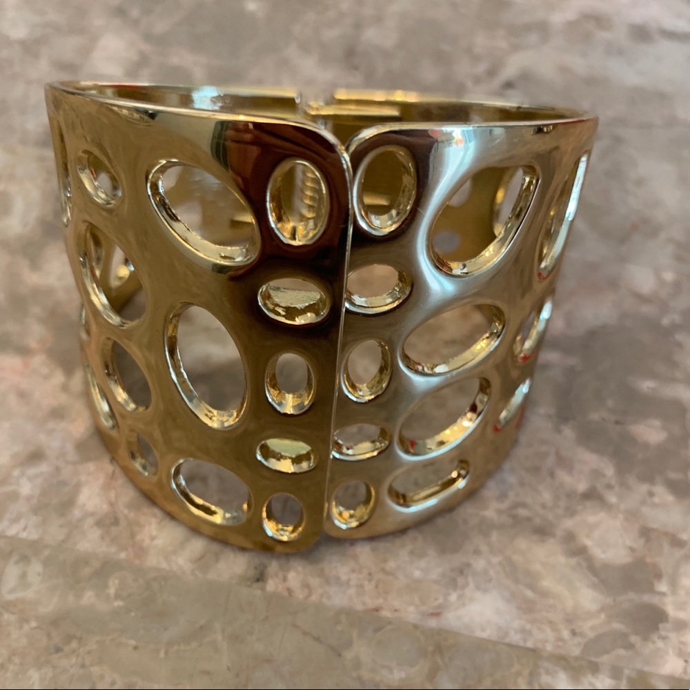 Gold tone hinged cuff bracelet